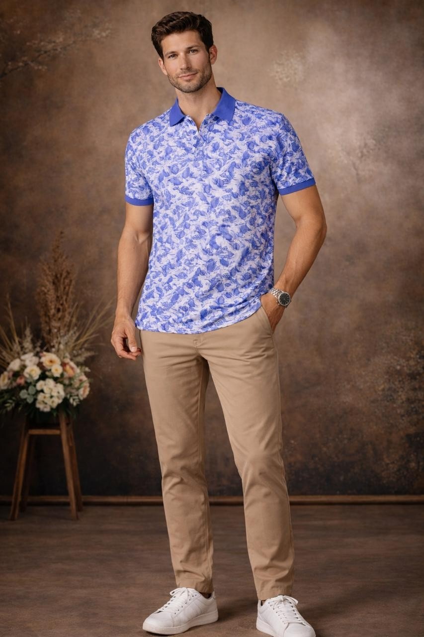 Front-facing view highlighting the all-over blue and white tropical leaf print on this stylish polo T-shirt, designed for fresh everyday wear.