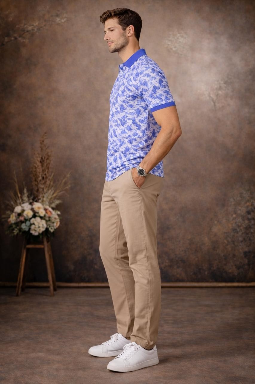 Side angle view showing the clean silhouette, smooth fabric, and detailed leaf print of the polo T-shirt.